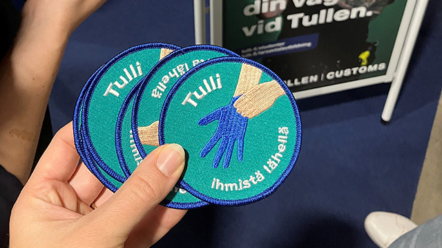Tulli - ihmistä lähellä kangasmerkki rekrymessuilla